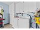 Laundry room with full sized washer and dryer and ample storage space at 9743 36Th N Way # 4, Pinellas Park, FL 33782