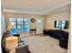 Inviting living room with a bright window, neutral tones, and cozy furnishings create a relaxing space at 9743 36Th N Way # 4, Pinellas Park, FL 33782
