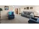 Comfortable living room with plush seating, neutral decor, and seamless flow into adjacent dining area for easy entertaining at 9743 36Th N Way # 4, Pinellas Park, FL 33782