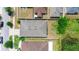Birds-eye view of single-story home with backyard, fence, and nearby pond at 10626 Laguna Plains Dr, Riverview, FL 33578