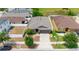Single-story home with fenced yard, landscaping, and a long driveway at 10626 Laguna Plains Dr, Riverview, FL 33578