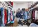 Spacious walk-in closet with custom shelving and ample storage for clothes, shoes, and accessories at 10626 Laguna Plains Dr, Riverview, FL 33578