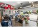 Cluttered garage filled with storage containers, household items, and tools, offering ample storage space at 10626 Laguna Plains Dr, Riverview, FL 33578
