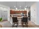 Open kitchen with granite countertops, bar seating, and stainless steel appliances at 10626 Laguna Plains Dr, Riverview, FL 33578