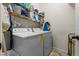 Well-equipped laundry room with washer, dryer, and shelving for efficient organization and storage at 10626 Laguna Plains Dr, Riverview, FL 33578