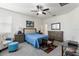 Relaxing main bedroom features a ceiling fan, soft carpet, neutral walls, and a coordinating furniture set at 10626 Laguna Plains Dr, Riverview, FL 33578