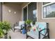 Cozy patio featuring comfortable chairs with decorative pillows and vibrant plants, ideal for relaxation at 10626 Laguna Plains Dr, Riverview, FL 33578