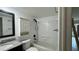 Bathroom featuring updated vanity and bath tub with white tile and updated fixtures at 11201 122Nd Ave # 103, Largo, FL 33778