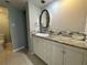 Bathroom featuring a vanity with a decorative mirror and tiled backsplash at 11201 122Nd Ave # 103, Largo, FL 33778