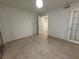Bedroom features neutral walls and tile flooring throughout at 11201 122Nd Ave # 103, Largo, FL 33778