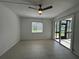 Bedroom featuring tile flooring, ceiling fan, window with blinds, and screened in patio access at 11201 122Nd Ave # 103, Largo, FL 33778
