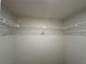 This is a walk-in closet with white walls and wire shelving at 11201 122Nd Ave # 103, Largo, FL 33778