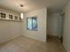 Dining area with tile flooring, natural light from window, and built-in cabinets at 11201 122Nd Ave # 103, Largo, FL 33778
