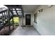 This exterior showcases a concrete porch and the stairwell leading to the second level condos at 11201 122Nd Ave # 103, Largo, FL 33778