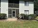 Exterior features a private, screened lanai and a well-maintained lawn, ideal for outdoor living at 11201 122Nd Ave # 103, Largo, FL 33778