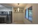Eat in kitchen with large stainless refrigerator and a breakfast nook with great natural light at 11201 122Nd Ave # 103, Largo, FL 33778