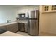 Kitchen boasts stainless steel appliances and charming blue backsplash at 11201 122Nd Ave # 103, Largo, FL 33778