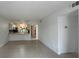 Open concept living room with tile flooring, view to the kitchen, and plenty of natural light at 11201 122Nd Ave # 103, Largo, FL 33778