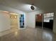 Living room features tile flooring, and glass sliding door to patio at 11201 122Nd Ave # 103, Largo, FL 33778