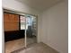 Enclosed patio features tile flooring, windows, and access to backyard at 11201 122Nd Ave # 103, Largo, FL 33778