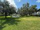 Scenic pond view with lush greenery and beautiful trees. Perfect for relaxation and nature lovers at 11201 122Nd Ave # 103, Largo, FL 33778