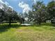 Scenic pond view with lush greenery and beautiful trees. Perfect for relaxation and nature lovers at 11201 122Nd Ave # 103, Largo, FL 33778