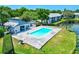 Community pool with ample seating and grilling area. Surrounded by well-maintained landscaping and greenery at 11201 122Nd Ave # 103, Largo, FL 33778
