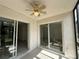 Screened porch with ceiling fan and access to the interior through sliding glass doors at 11201 122Nd Ave # 103, Largo, FL 33778