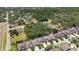 An aerial view of a residential neighborhood surrounded by lush greenery and mature trees at 11205 Lark Landing Ct, Riverview, FL 33569