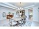 Inviting dining room with views of the stairway, piano, and kitchen at 11205 Lark Landing Ct, Riverview, FL 33569