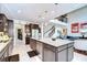Kitchen with stainless steel appliances and granite countertops that leads to a dining area and living room at 11205 Lark Landing Ct, Riverview, FL 33569