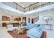 Bright, open-concept living room flows into the kitchen and features high ceilings and stylish decor at 11205 Lark Landing Ct, Riverview, FL 33569