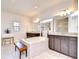 Large primary bath with dual sinks, vanity, shower, soaking tub, and vanity table at 11205 Lark Landing Ct, Riverview, FL 33569