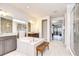 Bright primary bathroom with tub, vanities, granite countertops, and a glass-enclosed shower at 11205 Lark Landing Ct, Riverview, FL 33569