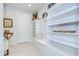 Bright mudroom featuring built-in storage, a bench, and decor shelving for organized and stylish functionality at 11205 Lark Landing Ct, Riverview, FL 33569