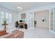 Spacious home office with tile flooring, plantation shutters, and French doors at 11205 Lark Landing Ct, Riverview, FL 33569