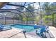 Screened-in pool and patio area, complete with comfortable lounge chairs and an inviting spa at 11205 Lark Landing Ct, Riverview, FL 33569