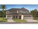 A beautifully built two-story home featuring a two-car garage, manicured lawn, and a combination of stone and siding details at 11837 Blue Diamond Trl, Parrish, FL 34219