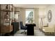 Bright home office featuring a modern desk, comfortable seating, and stylish decor, creating an inviting and functional workspace at 11837 Blue Diamond Trl, Parrish, FL 34219