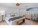 Bright bedroom with stylish furnishings, including a soft headboard, wooden bench, and neutral decor at 1207 S Druid Ln, Tampa, FL 33629