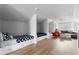 Large bonus room with built-in beds, comfortable seating, and light-colored wood floors at 1207 S Druid Ln, Tampa, FL 33629