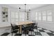 Bright dining room features black-and-white tile, built-in bench seating, and plantation shutters at 1207 S Druid Ln, Tampa, FL 33629
