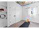 Bright exercise room with high ceilings, featuring floral wallpaper, shelving, and a large window with natural light at 1207 S Druid Ln, Tampa, FL 33629