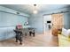 Stylish office with a sliding barn door, built-in cabinets, and elegant decor create a productive workspace at 1207 S Druid Ln, Tampa, FL 33629