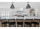 Bright kitchen featuring a large island, quartz countertops, and modern appliances at 1207 S Druid Ln, Tampa, FL 33629