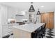 Bright kitchen featuring a large island, quartz countertops, and modern appliances at 1207 S Druid Ln, Tampa, FL 33629