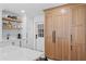 Bright kitchen featuring custom wood pantry and cabinetry, quartz countertops, and modern appliances at 1207 S Druid Ln, Tampa, FL 33629