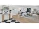Bright living room filled with modern art has hardwood floors and an open floor plan at 1207 S Druid Ln, Tampa, FL 33629