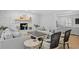 Relaxing living room with a whitewashed brick fireplace, comfortable seating, and hardwood floors at 1207 S Druid Ln, Tampa, FL 33629