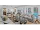 Bright living room features lots of natural light and access to the outdoor pool area at 1207 S Druid Ln, Tampa, FL 33629